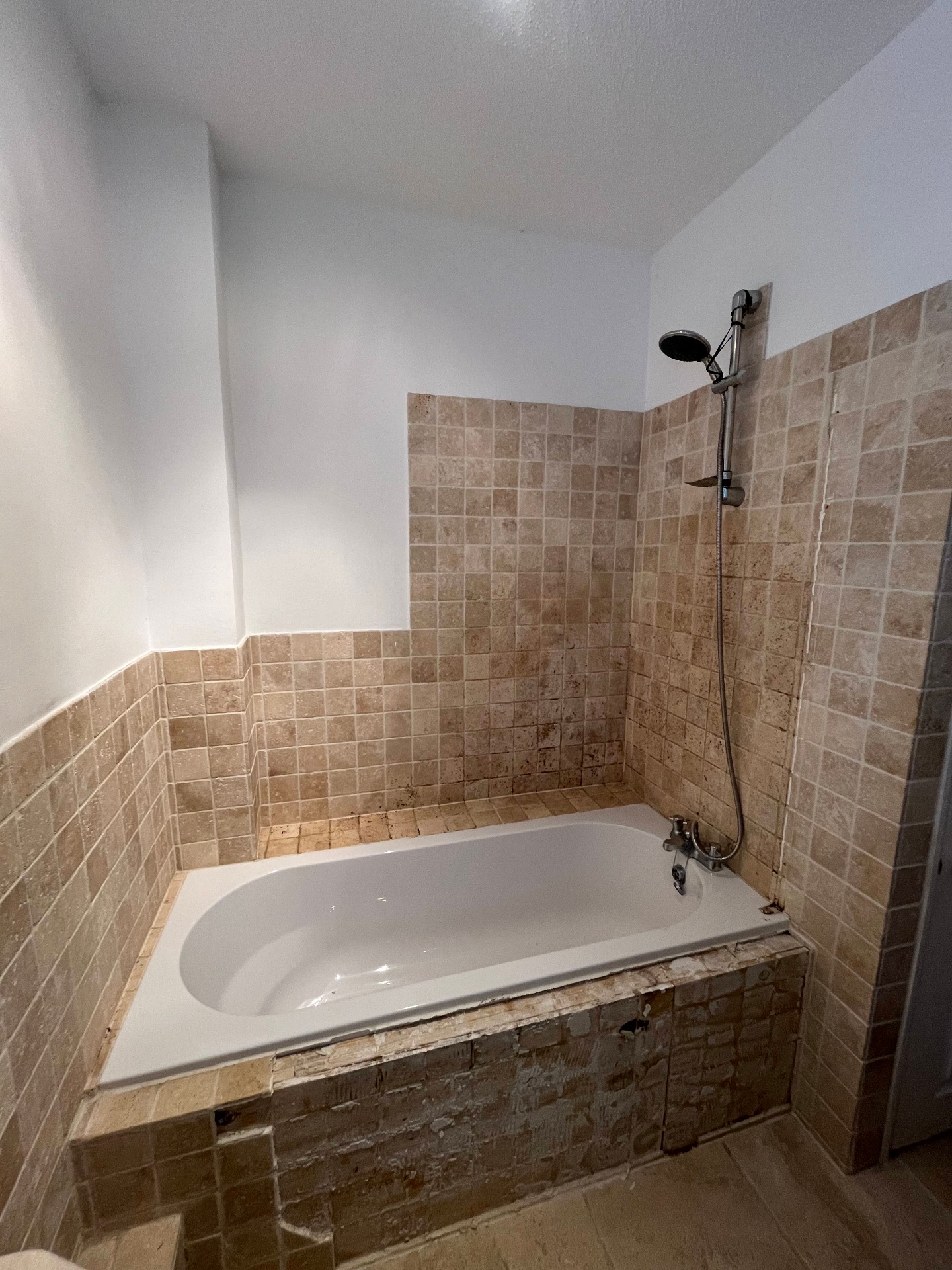 Bathroom before bath to shower conversion in Torquay - old bath with dated tiles